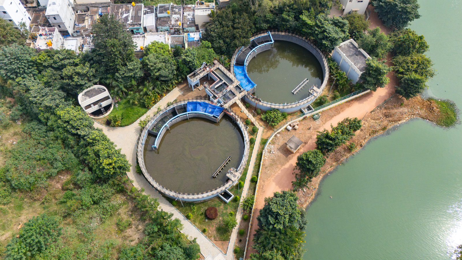 Aerial view of an industrial wastewater treatment plant showing clarifier and treatment units